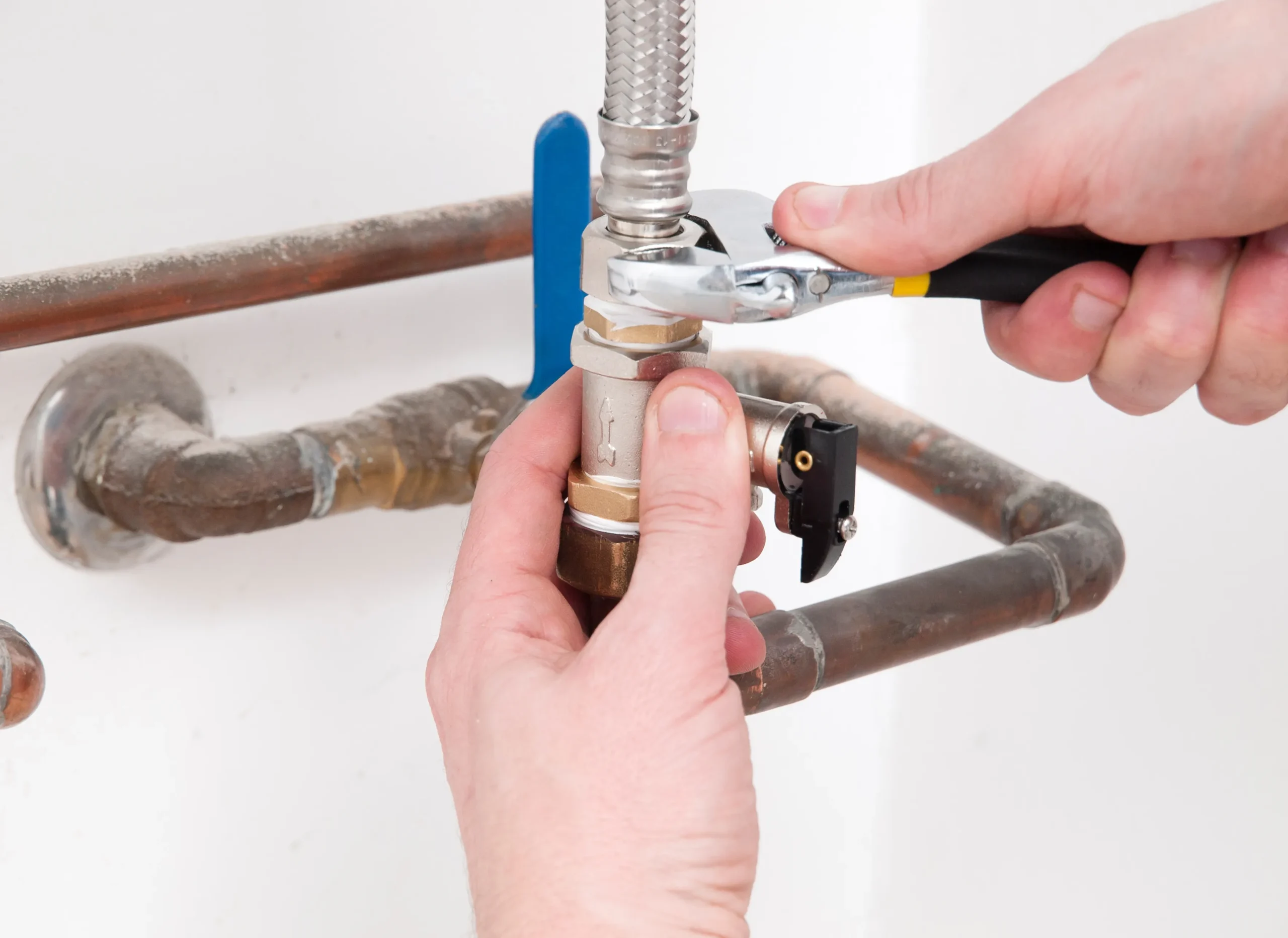 A technician performing burst pipe repair in Des Moines, IA