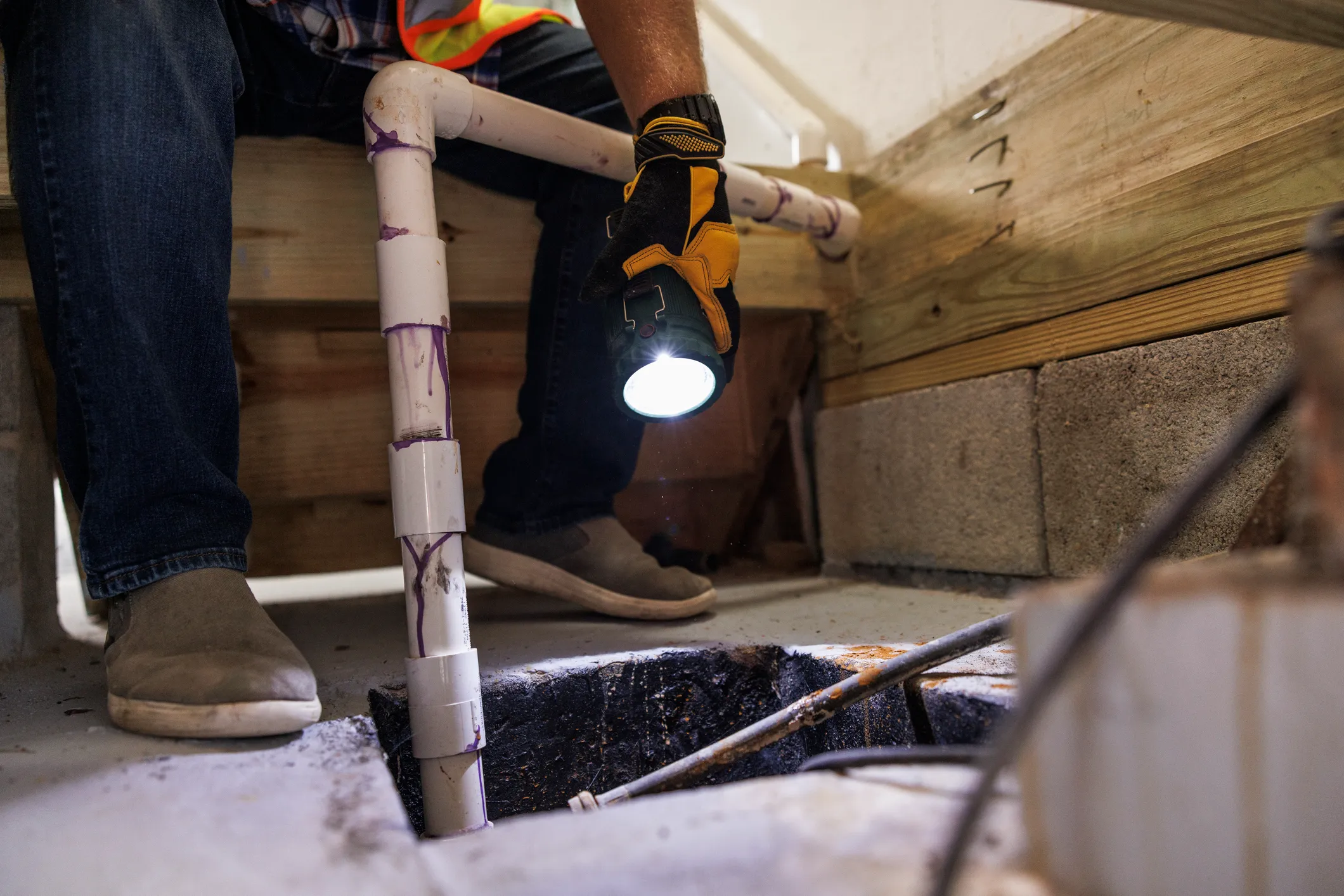 A technician performing Sump Pump Replacement In Des Moines, IA